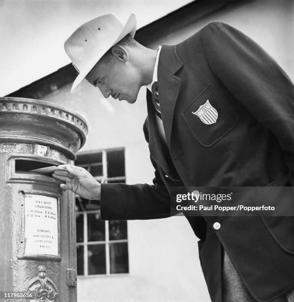 American 800 Metres runner Mal Whitfield posting a letter home from the Olympic training centre at Uxbridge, Middlesex, during the London Olympics,...