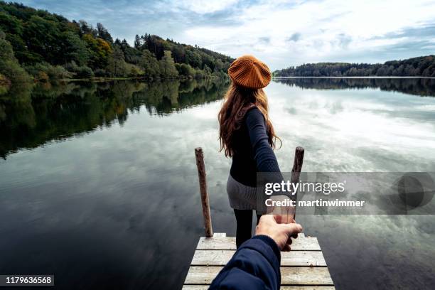 folllow me shot at an austrian lake - pov walking stock pictures, royalty-free photos & images