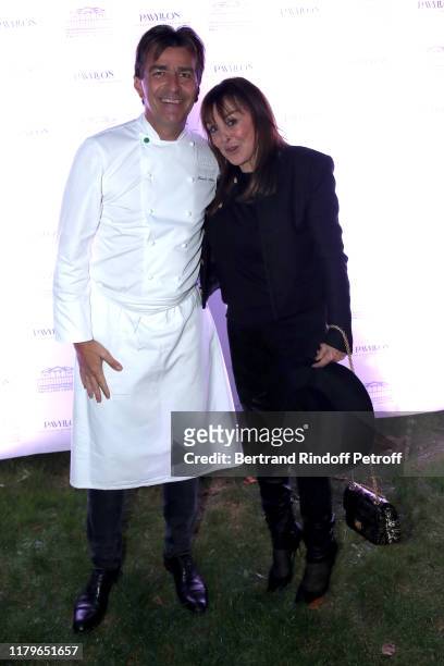 Chef Yannick Alleno and Babeth Djian attend the Inauguration evening of "PavYllon - a restaurant by Yannick Alleno" at Pavillon Ledoyen on October...