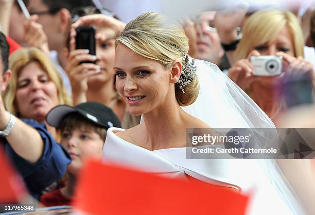 Princess Charlene of Monaco arrives at Sainte Devote church after the religious wedding ceremony to Prince Albert II of Monaco at the Prince's Palace...
