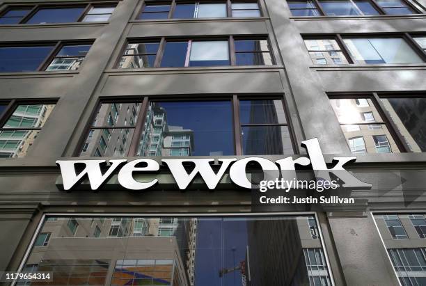Sign is posted on the exterior of a WeWork office on October 07, 2019 in San Francisco, California. Days after withdrawing its registration for an...
