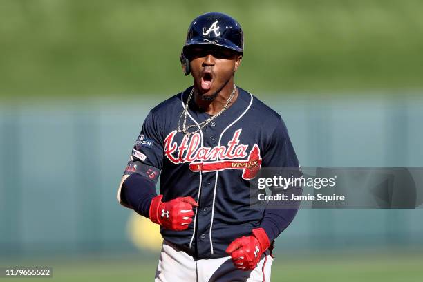 Ozzie Albies of the Atlanta Braves celebrates after hitting a two-run home run against the St. Louis Cardinals during the fifth inning in game four...