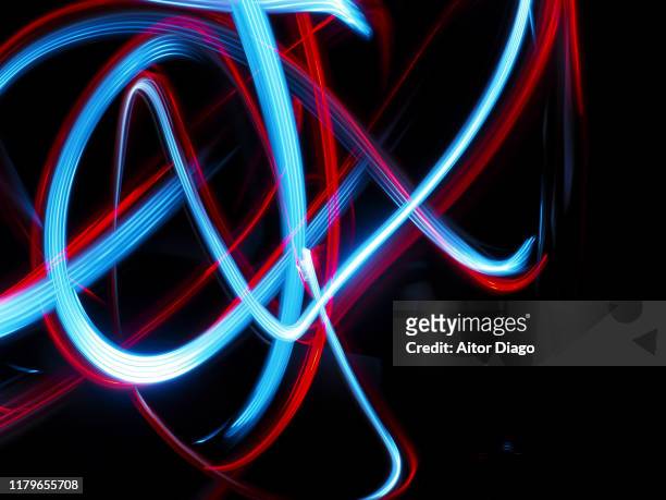chaos concept. messy moving lines - light painting stock pictures, royalty-free photos & images