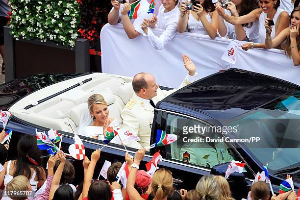 Prince Albert II of Monaco and Princess Charlene of Monaco depart from Sainte Devote church after their religious wedding ceremony at the Prince's...