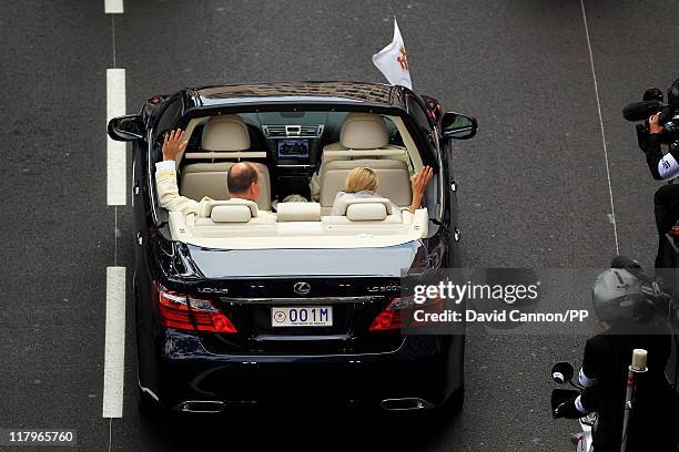 Prince Albert II of Monaco and Princess Charlene of Monaco depart from Sainte Devote church after their religious wedding ceremony at the Prince's...