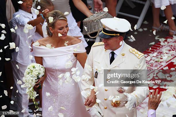 Princess Charlene of Monaco and Prince Albert II of Monaco leave the religious ceremony of the Royal Wedding of Prince Albert II of Monaco to...