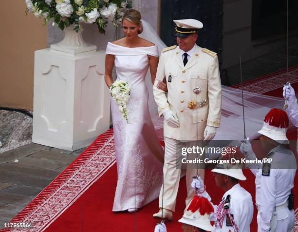 Princess Charlene of Monaco and Prince Albert II of Monaco leave the religious ceremony of the Royal Wedding of Prince Albert II of Monaco to...