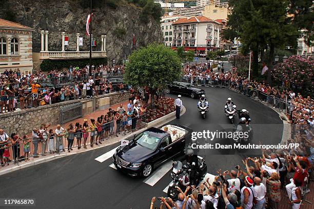 The car drives through the street after the religious ceremony of the Royal Wedding of Prince Albert II of Monaco to Charlene Wittstock on July 2,...