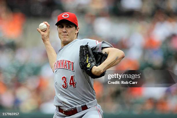 Starting pitcher Homer Bailey of the Cincinnati Reds delivers to a Baltimore Orioles batte at Oriole Park at Camden Yards on June 26, 2011 in...