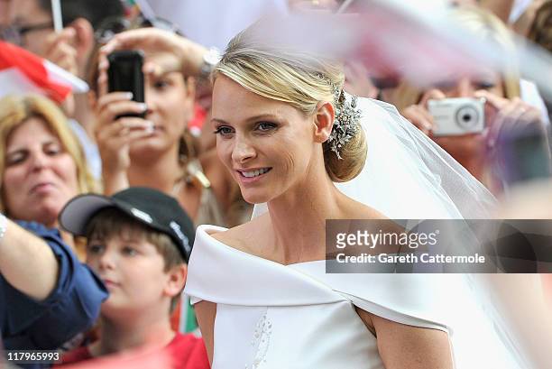 Princess Charlene of Monaco arrives at Sainte Devote church after the religious wedding ceremony to Prince Albert II of Monaco at the Prince's Palace...