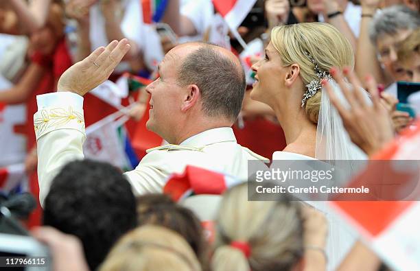Prince Albert II of Monaco and Princess Charlene of Monaco arrive at Sainte Devote church after their religious wedding ceremony at the Prince's...