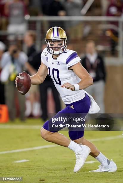 Jacob Eason of the Washington Huskies scramble away from the pressure against the Stanford Cardinal during the second quarter of an NCAA football...