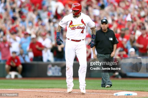 Yadier Molina of the St. Louis Cardinals celebrates after hitting an RBI game-tying single against the Atlanta Braves during the eighth inning in...