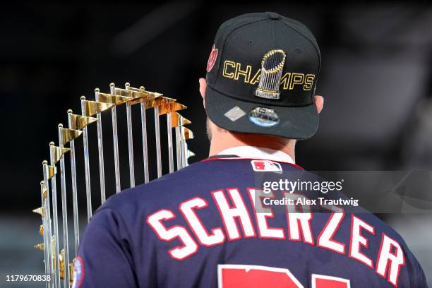 Max Scherzer of the Washington Nationals holds the Commissioner's Trophy during the 2019 World Series victory parade on Saturday, November 2, 2019 in...