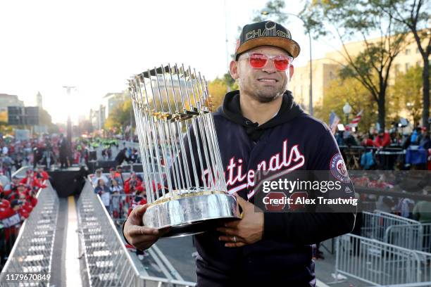 Gerardo Parra of the Washington Nationals poses for a photo with the Commissioner's Trophy during the 2019 World Series victory parade on Saturday,...