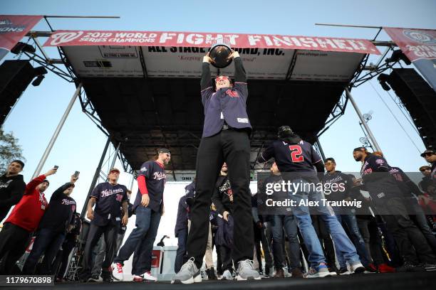 Patrick Corbin of the Washington Nationals holds the Commissioner's Trophy during the 2019 World Series victory parade on Saturday, November 2, 2019...