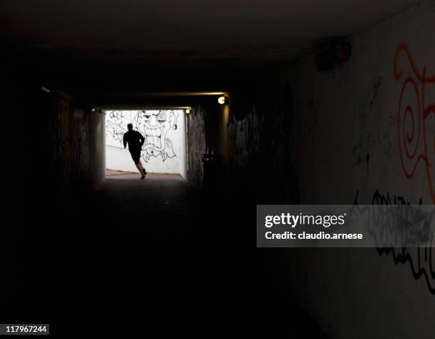 escape from tunnel. color image - ondergrond stockfoto's en -beelden