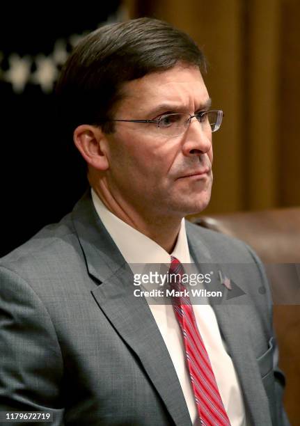 Secretary of Defense Mark Esper listens to U.S. President Donald Trump speak after getting a briefing from senior military leaders in the Cabinet...