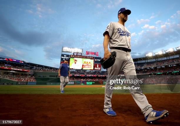 Starting pitcher Rich Hill of the Los Angeles Dodgers walks back to the dug out before the start of game four of the National League Division Series...