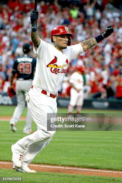 Yadier Molina of the St. Louis Cardinals celebrates as he hits a walk-off sacrifice fly to give his team the 5-4 win over the Atlanta Braves in game...