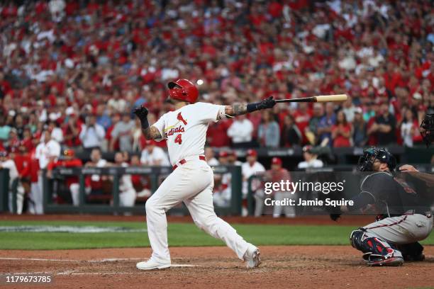 Yadier Molina of the St. Louis Cardinals hits a walk-off sacrifice fly to give his team the 5-4 win over the Atlanta Braves in game four of the...