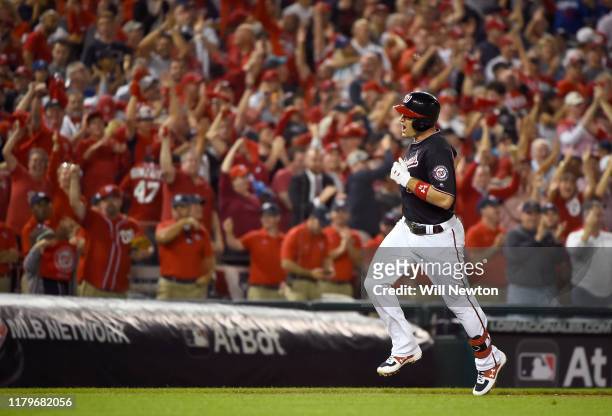 Ryan Zimmerman of the Washington Nationals celebrates as he runs the bases after his three run home run in the fifth inning of game four of the...
