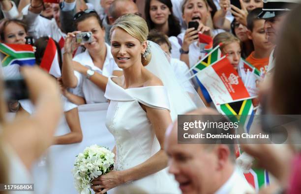 Princess Charlene of Monaco arrives at Sainte Devote church after the religious wedding ceremony to Prince Albert II of Monaco after the religious...