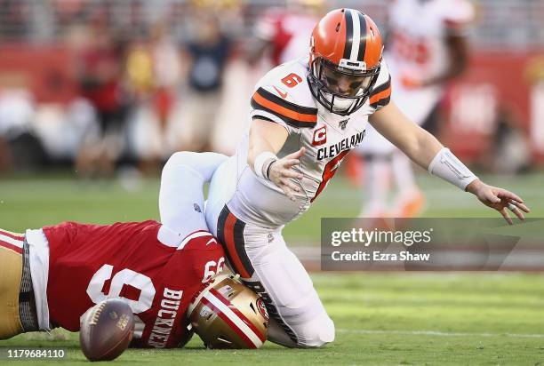 Quarterback Baker Mayfield of the Cleveland Browns fumbles as he is tackled by DeForest Buckner of the San Francisco 49ers during the game at Levi's...