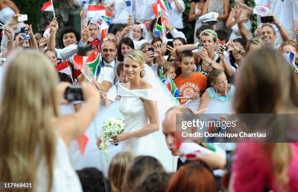 Princess Charlene of Monaco arrives at Sainte Devote church after the religious wedding ceremony to Prince Albert II of Monaco after the religious...