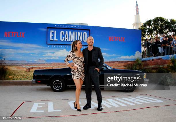 Lauren Paul and Aaron Paul attend the World Premiere of "El Camino: A Breaking Bad Movie" at the Regency Village on October 07, 2019 in Los Angeles,...