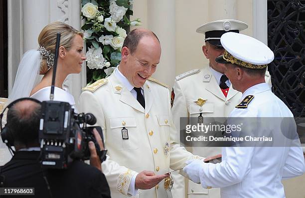 Prince Albert II of Monaco and Princess Charlene of Monaco leave Sainte Devote church after the religious ceremony of their Royal Wedding at the...