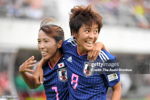 Mana Iwabuchi of Japan celebrates scoring the opening goal with her team mate Emi Nakajima during the international friendly match between Japan and...