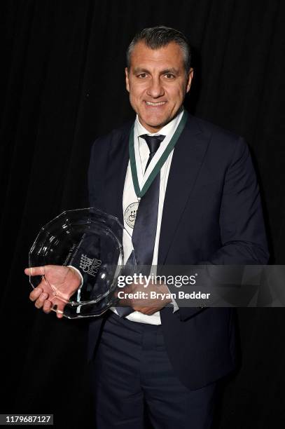 Cristian Vieri poses with an award during the 34th Annual Great Sports Legends Dinner To Benefit The Buoniconti Fund To Cure Paralysis at The Hilton...