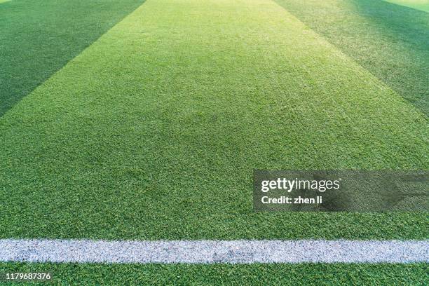 football green grass field - fussball rasen stock-fotos und bilder