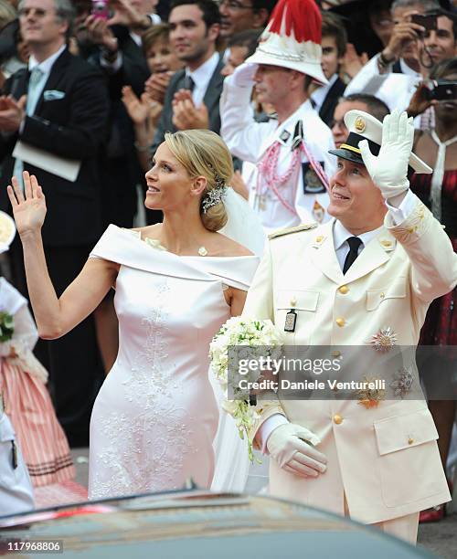 Princess Charlene of Monaco and Prince Albert II of Monaco make their journey to Sainte Devote church after their religious wedding ceremony at the...