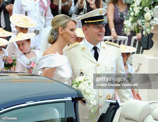 Princess Charlene of Monaco and Prince Albert II of Monaco make their journey to Sainte Devote church after their religious wedding ceremony at the...