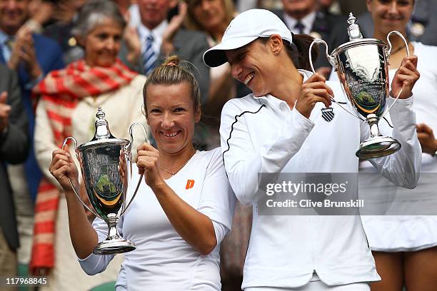 Kveta Peschke of the Czech Republic and Katarina Srebotnik of Slovenia hold up their championship trophies after winning their final round Ladies'...