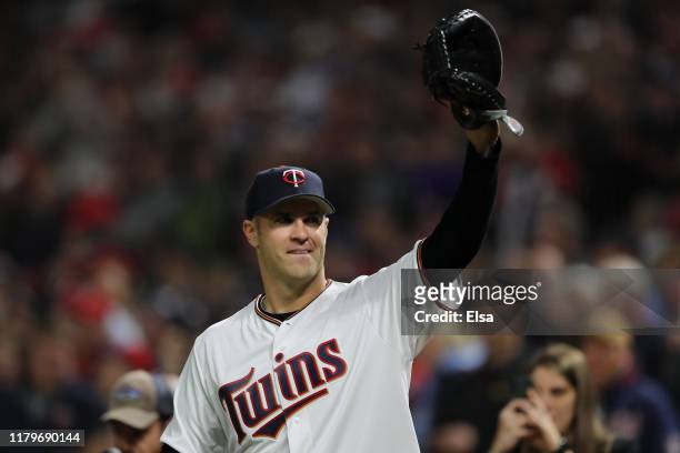 Former Minnesota Twins Joe Mauer waves to the fans prior to game three of the American League Division Series between the New York Yankees and the...
