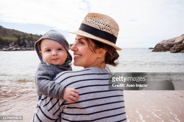 mother and toddler son at the beach - townsville australien stock-fotos und bilder