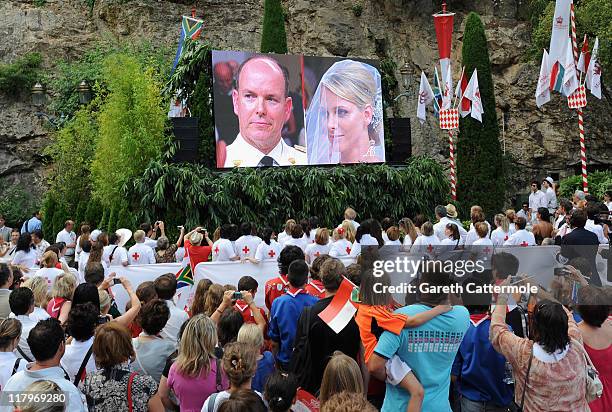 Crowds watch the big screen of the the religious wedding ceremony of Prince Albert II of Monaco and Princess Charlene of Monaco at the Sainte Devote...