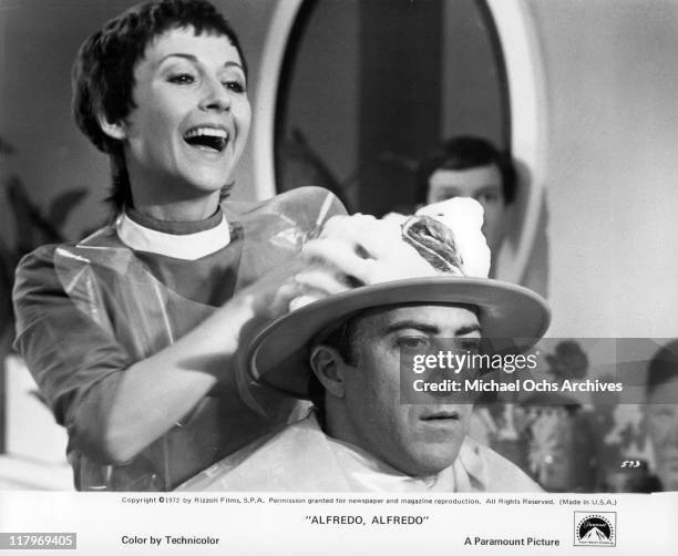 Carla Gravina shampooing Dustin Hoffman's hair in a scene from the film 'Alfredo, Alfredo', 1973.