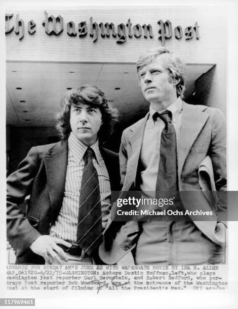 Dustin Hoffman and Robert Redford standing in front of 'The Washington Post' in a scene from the film 'All the President's Men', 1976.