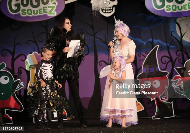 Penna Ziering, Erin Ziering, Kenzie Cameron, and Beverley Mitchell onstage at the GoGo squeeZ GoGoWeen Halloween Launch Event on October 07, 2019 in...