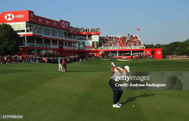 Rory McIlroy of Northern Ireland hits his third shot on the 18th hole during Day Four of the WGC HSBC Champions at Sheshan International Golf Club on...