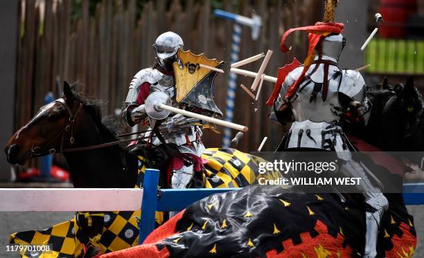 England's Andrew Deane jousts with Australia's Phil Leitch during the inaugural "Ashes" jousting tournament between Australia and England at the...