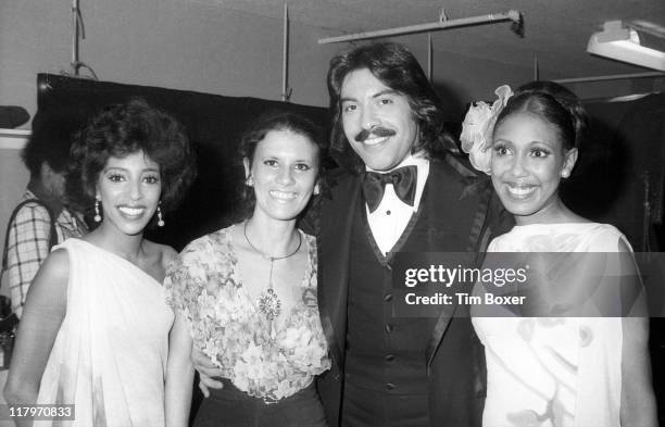 Portrait of, from left, American singers Joyce Vincent, unidentified, Tony Orlando, and Thelma Hopkins, backstage at the 17th Grammy Awards, held at...