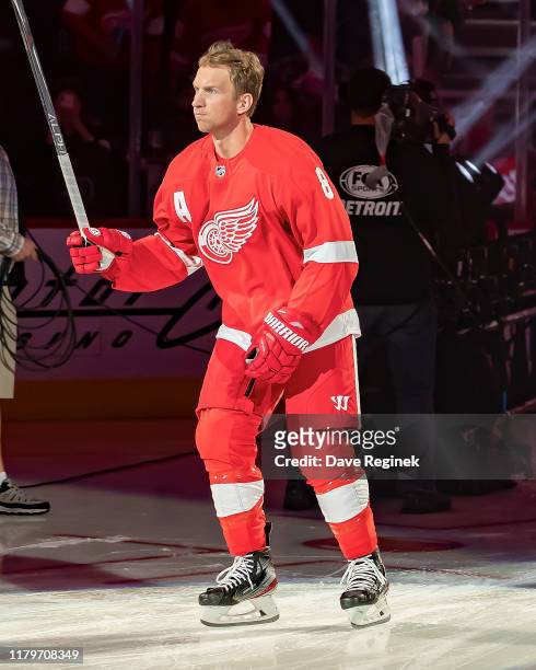 Justin Abdelkader of the Detroit Red Wings takes to the ice during the opening night ceremony prior to an NHL against the Dallas Stars during an NHL,...
