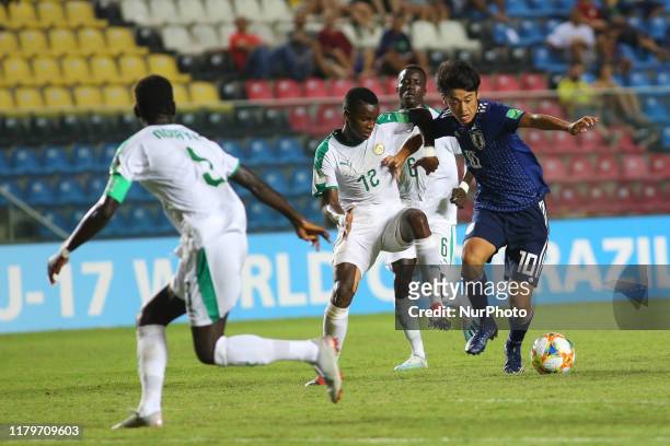 Jun Nishikawa of Japan and Birame Diaw of Senegal fight for the ball during the FIFA U-17 World Cup Brazil 2019 group D match between Senegal and...