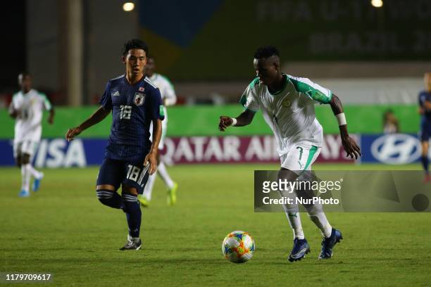 Aliou Balde of Senegal and Kohshiro Sumi of Japan during the FIFA U-17 World Cup Brazil 2019 group D match between Senegal and Japan at Estadio...
