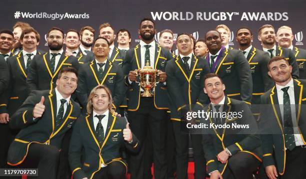 South Africa players pose for a photo ahead of a World Rugby award ceremony in Tokyo on Nov. 3 a day after they defeated England to claim the...